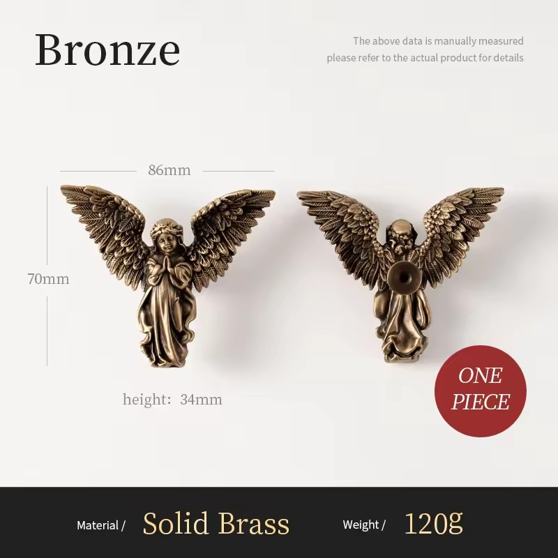 MIRABELLE antique brass angel knob styled on a dark painted bathroom cabinet door