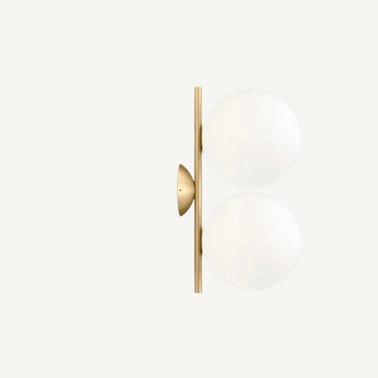 Angle view of VITTORIO double ball wall lamp showing twin spherical shades and Italian artisan metalwork arm