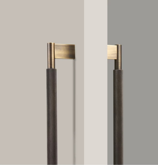 Angle view of solid brass cross knurled pull bar handle showing detailed knurled grip texture for secure hold