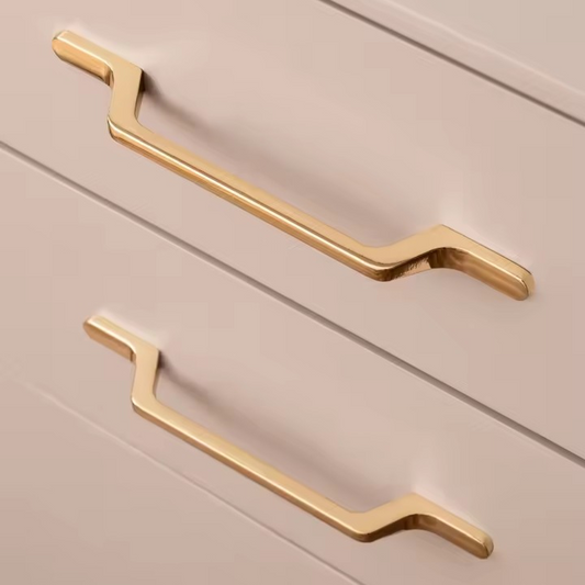 Finley gold cabinet pulls angled view showing the elongated bar design in polished brass finish