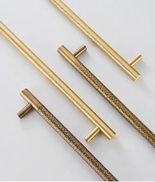 SIENA hammered brass door pull angled view showing tactile hammered texture and antique brass finish