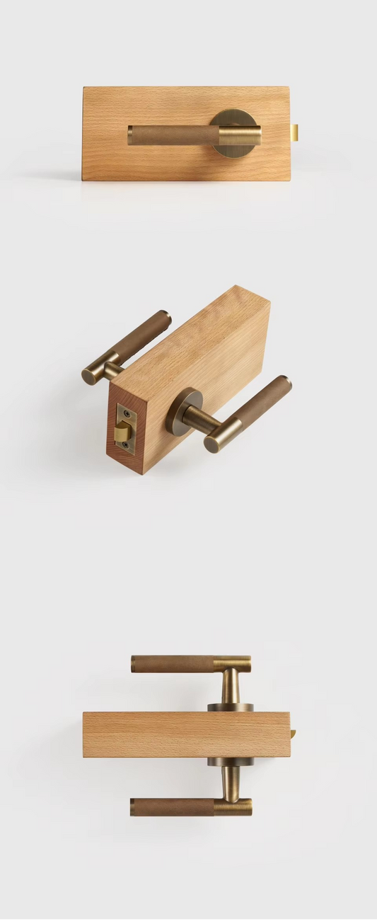 Leather brass door lever handle angled view showing the stitched leather grip and solid brass backplate
