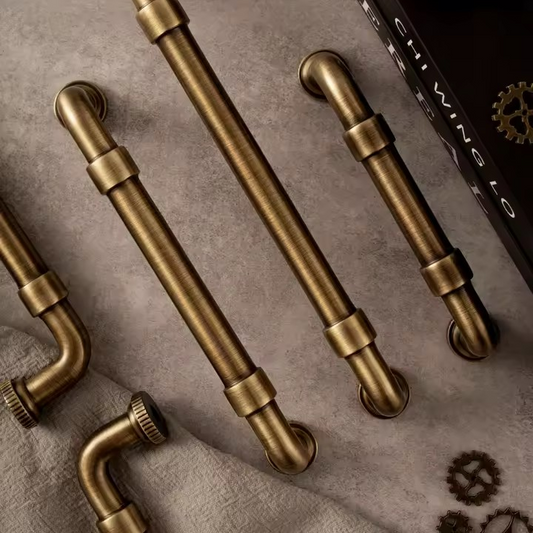 DARCY antique bronze cabinet pull in aged finish — solid brass cup pull for kitchen and wardrobe drawers