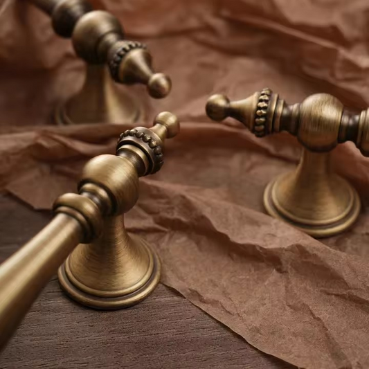ROSENDALE antique brass pull handle angled view showing curved bail and aged bronze patina detail