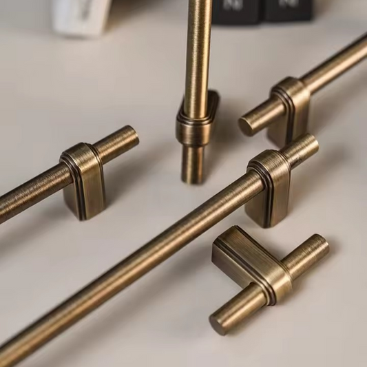 Side angle view of HARRIGTON solid brass T-bar handle showing sleek bar profile and fixing points