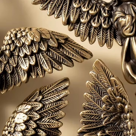 MIRABELLE antique brass angel cabinet knob hero shot — hand-cast cherub figure with aged brass patina