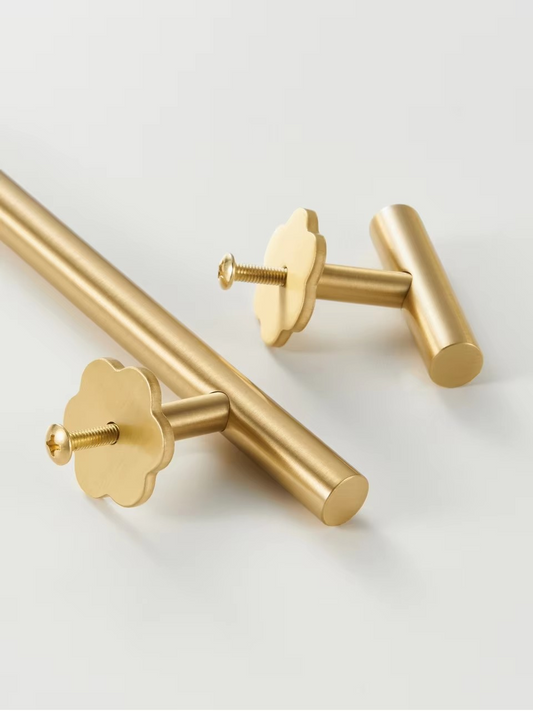 Margaux hexapetal flower cabinet pull angled view showing petal relief and polished brass sheen