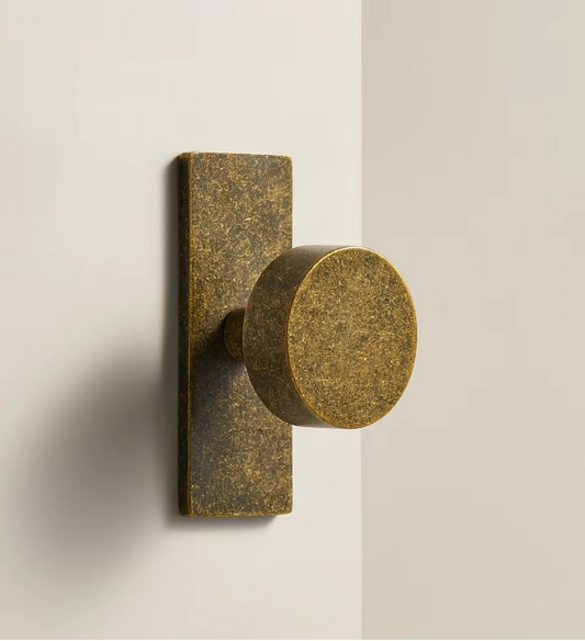 Angle view of THORNFIELD antique snowflake bronze knob showing intricate cast surface detail and aged bronze finish