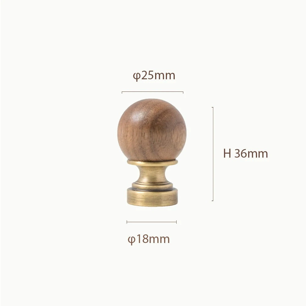 CHESTER walnut and brass knob close-up showing the smooth domed top and wood grain