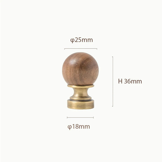 CHESTER walnut and brass knob close-up showing the smooth domed top and wood grain