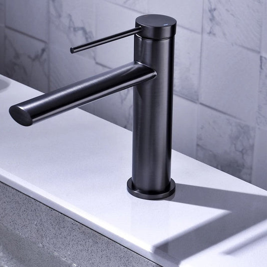 OSCAR brushed brass basin mixer faucet photographed at an angle highlighting the spout and lever