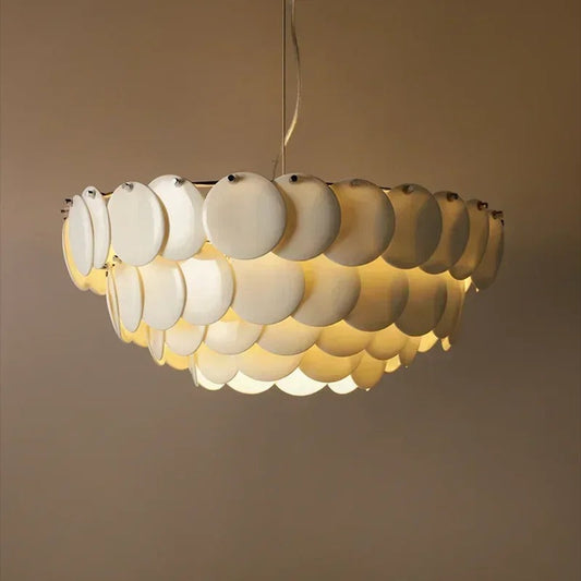 PEMBRIDGE ceramic chandelier photographed from below showing the warm glow through each ceramic shade