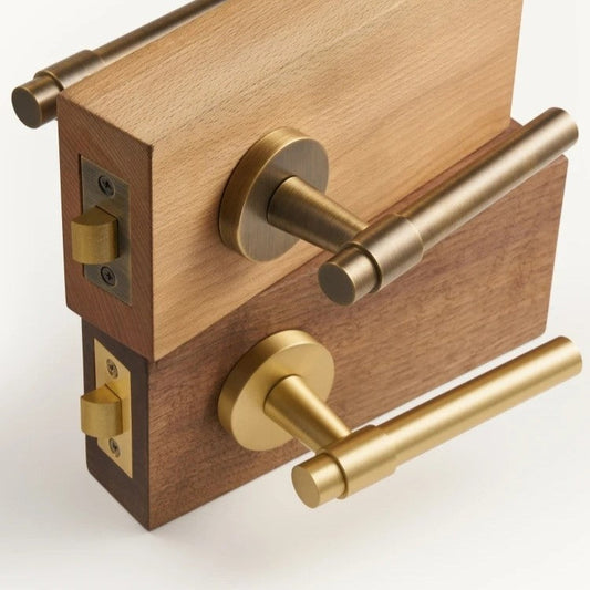 Brushed brass door lever handle close-up showing smooth plain profile and natural luster