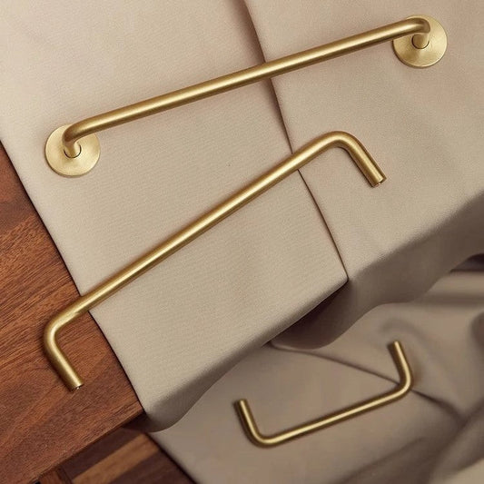 Nordic brass long cabinet handle shown at side angle — slender bar profile