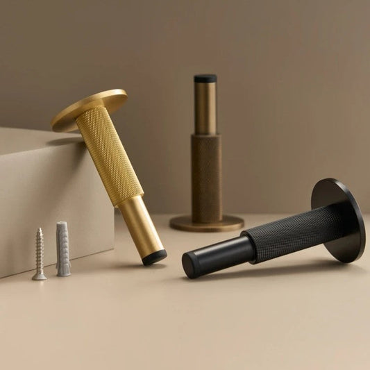 Knurled brass door stop close-up showing precision diamond knurling texture and heavy-duty build