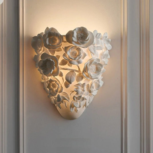 Madeleine French carved wall light styled in an elegant bedroom with warm ambient glow