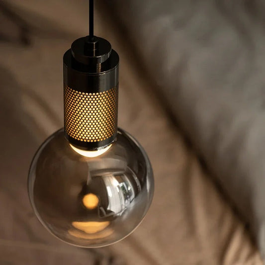 Étienne glass wall lamp angled view showing the bracket arm projection and globe shade relationship