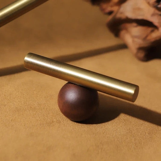 CHESTER pull bar side angle showing the walnut wood centre and polished brass ends