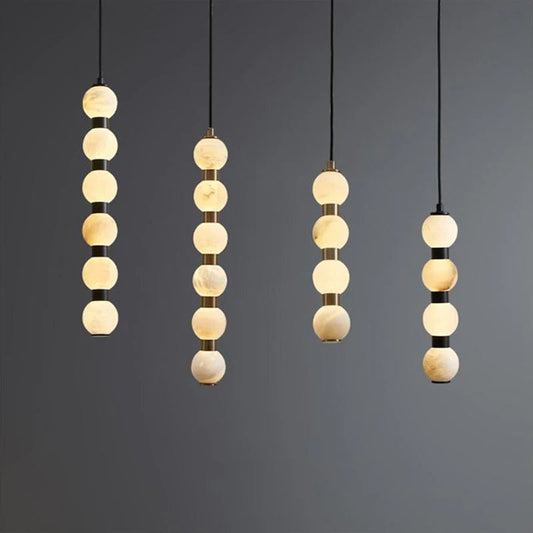 AMELIE marble pendant angled view showing natural stone texture and brass detail