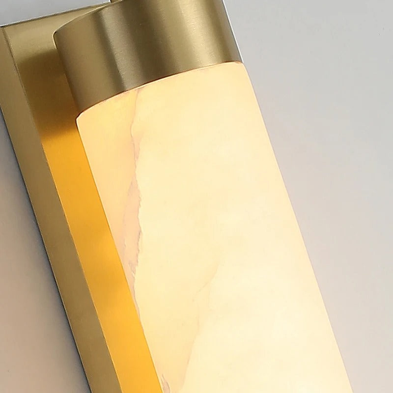 Detail of marble shade and brass fitting on double wall sconce