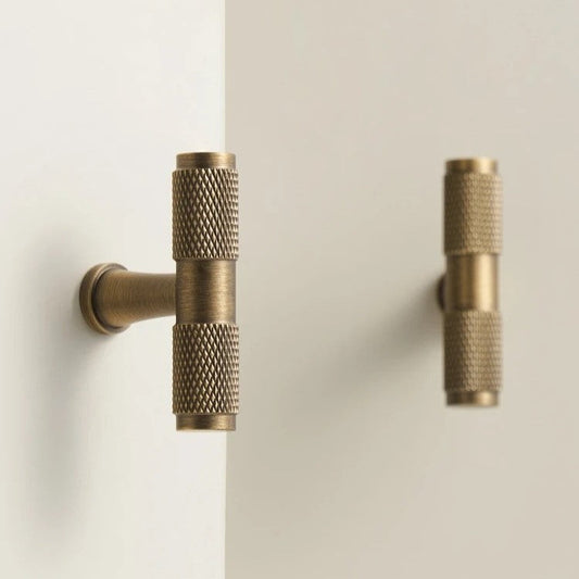 QUILL diamond-knurled cabinet knob photographed at an angle to highlight the cut-knurl surface texture