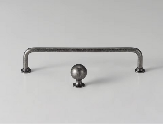 Angle view of silver antique arched knob handle showing rounded dome profile and antique silver patina finish