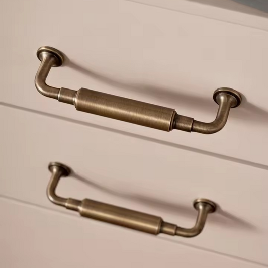 Antique brass T-bar cabinet pull angled view showing the bar profile and mounting screw positions