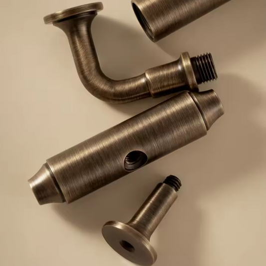 Hampton antique brass T-bar cabinet pull angled view showing the elongated bar and warm patina finish