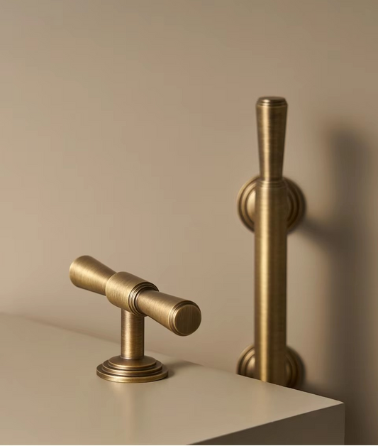 Vintage T-bar handle photographed from above showing the straight bar and tapered end details