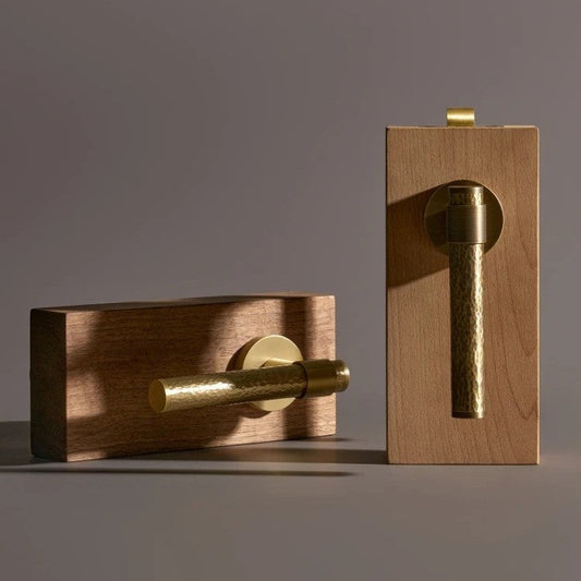 Solid brass lever door handle fitted to an interior door — how to remove a door handle step by step