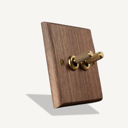 Black walnut 2-gang toggle switch with brass lever for hallway and bedroom lighting