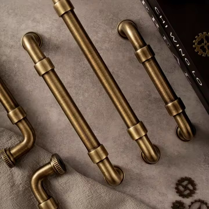DARCY antique bronze cabinet pull in aged finish — solid brass cup pull for kitchen and wardrobe drawers