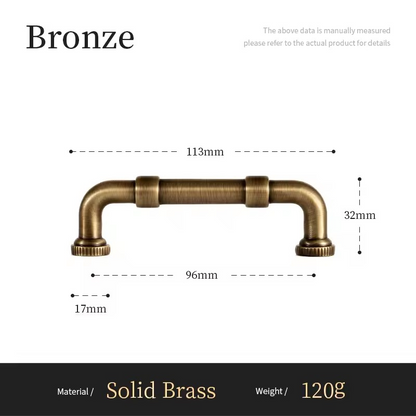 DARCY antique bronze bar pull on sage green kitchen cabinetry in a period-style kitchen