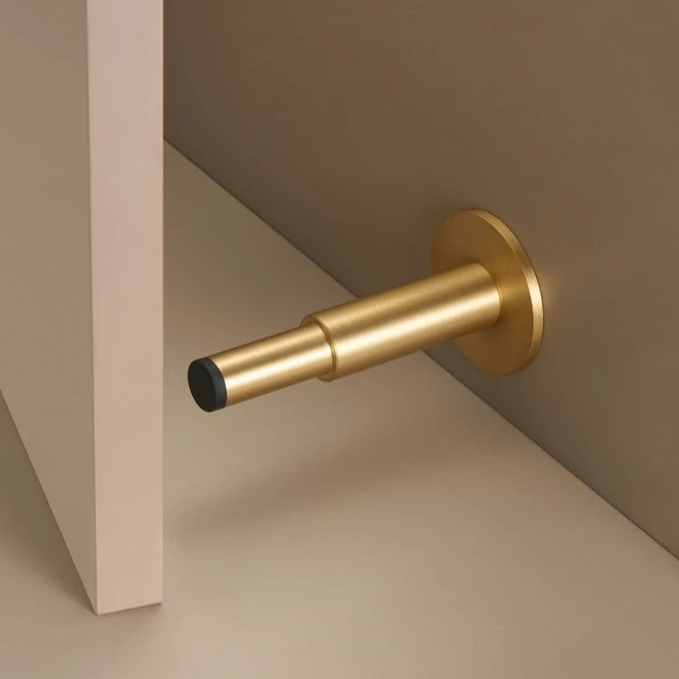 Plain solid brass silent door stopper in antique brass — minimalist floor or wall mount