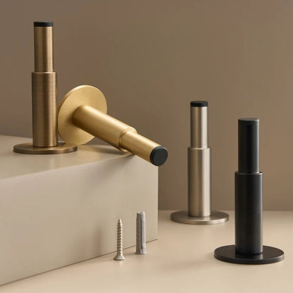 Solid brass door stop close-up showing smooth plain profile and 3dB sound-dampening core