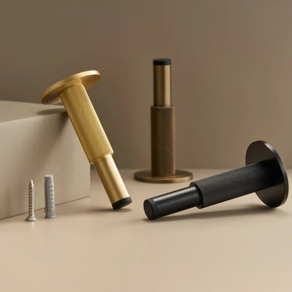 Knurled brass door stop close-up showing precision diamond knurling texture and heavy-duty build