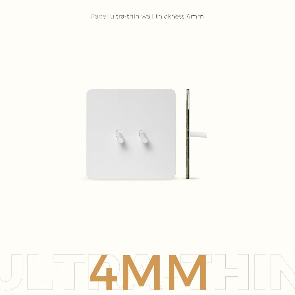 White switch plate close-up showing smooth metallic stainless steel surface